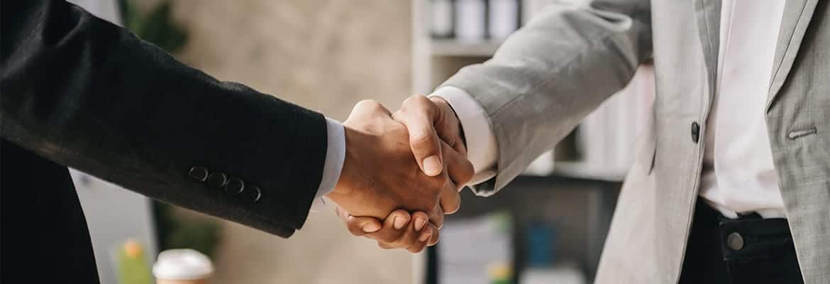 A close-up of two people shaking hands