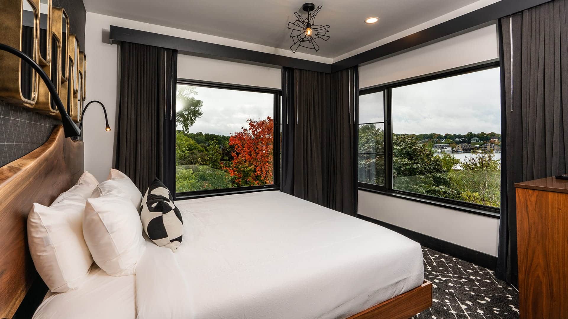 A bed with a window in a room