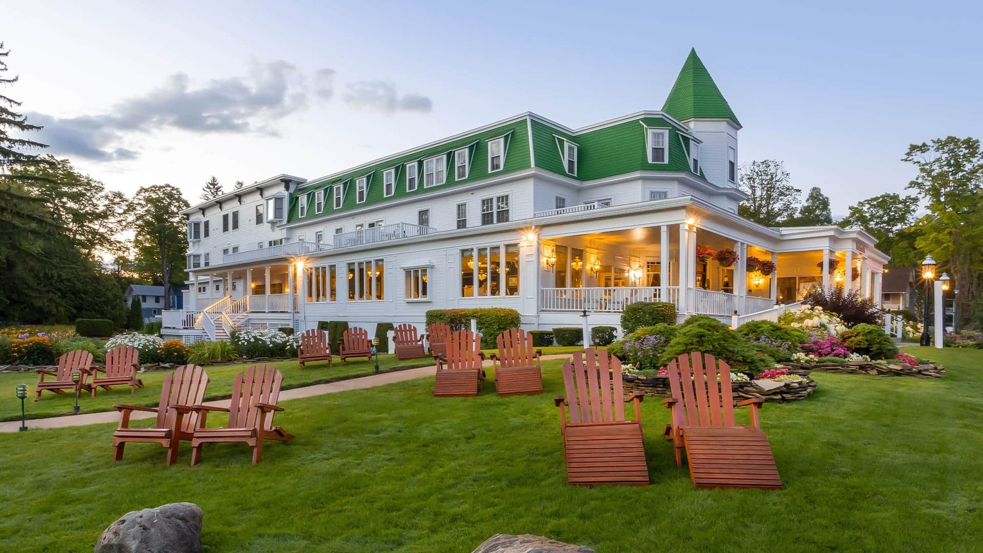 Lawn chairs in front of a large white building