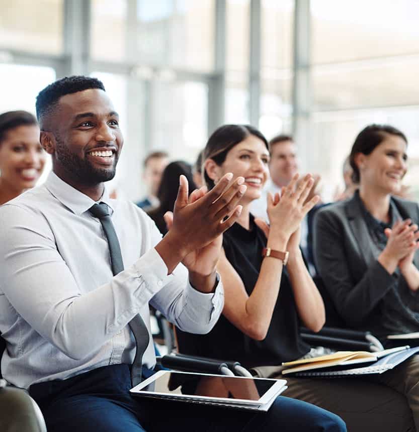 A group of people clapping