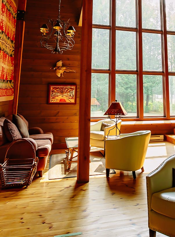 A living room with a couch and a lamp