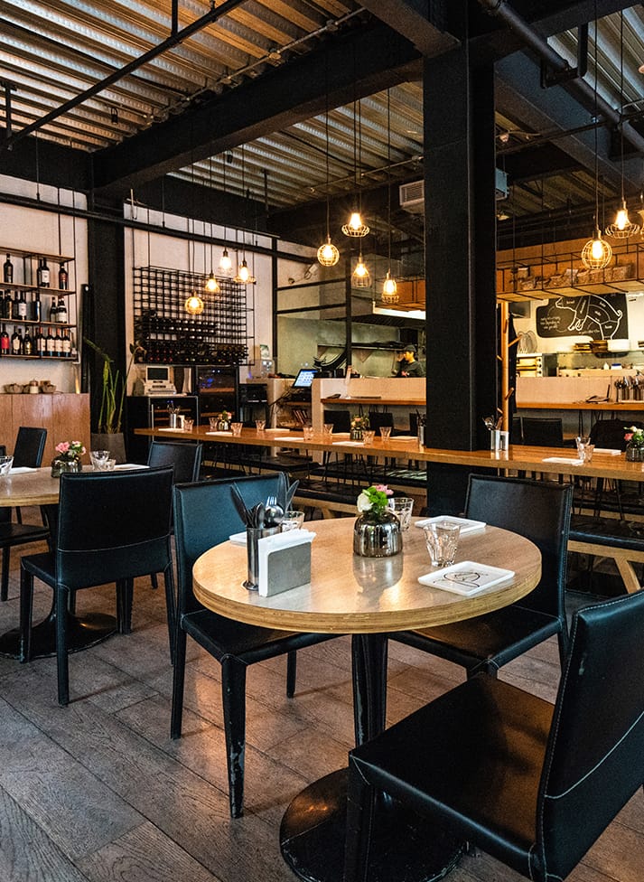 A restaurant with tables and chairs