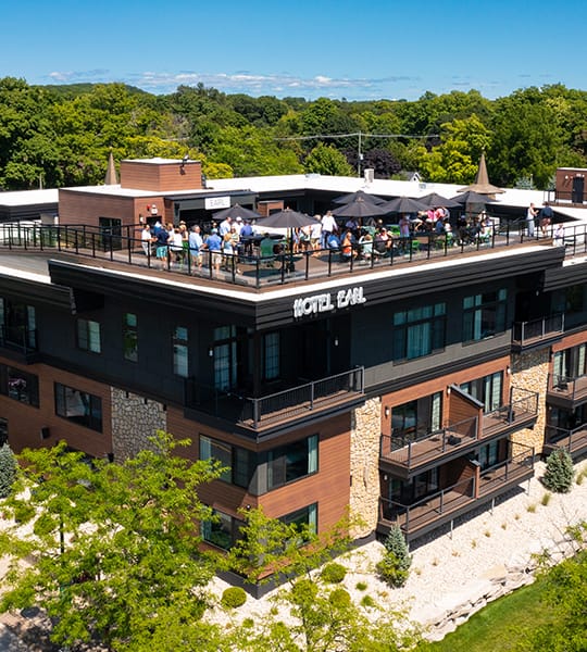 A group of people on a rooftop of a hotel