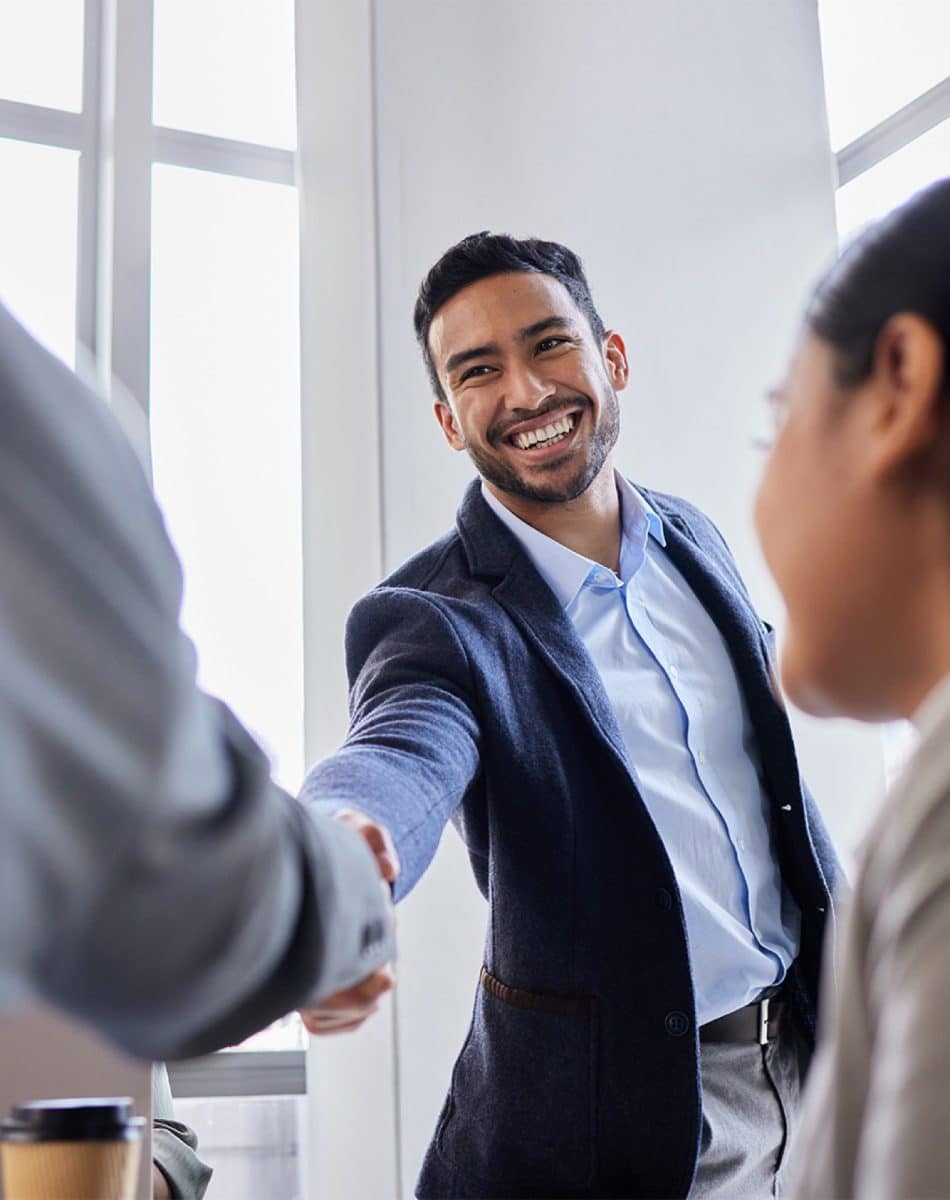 A man shaking hands with a woman
